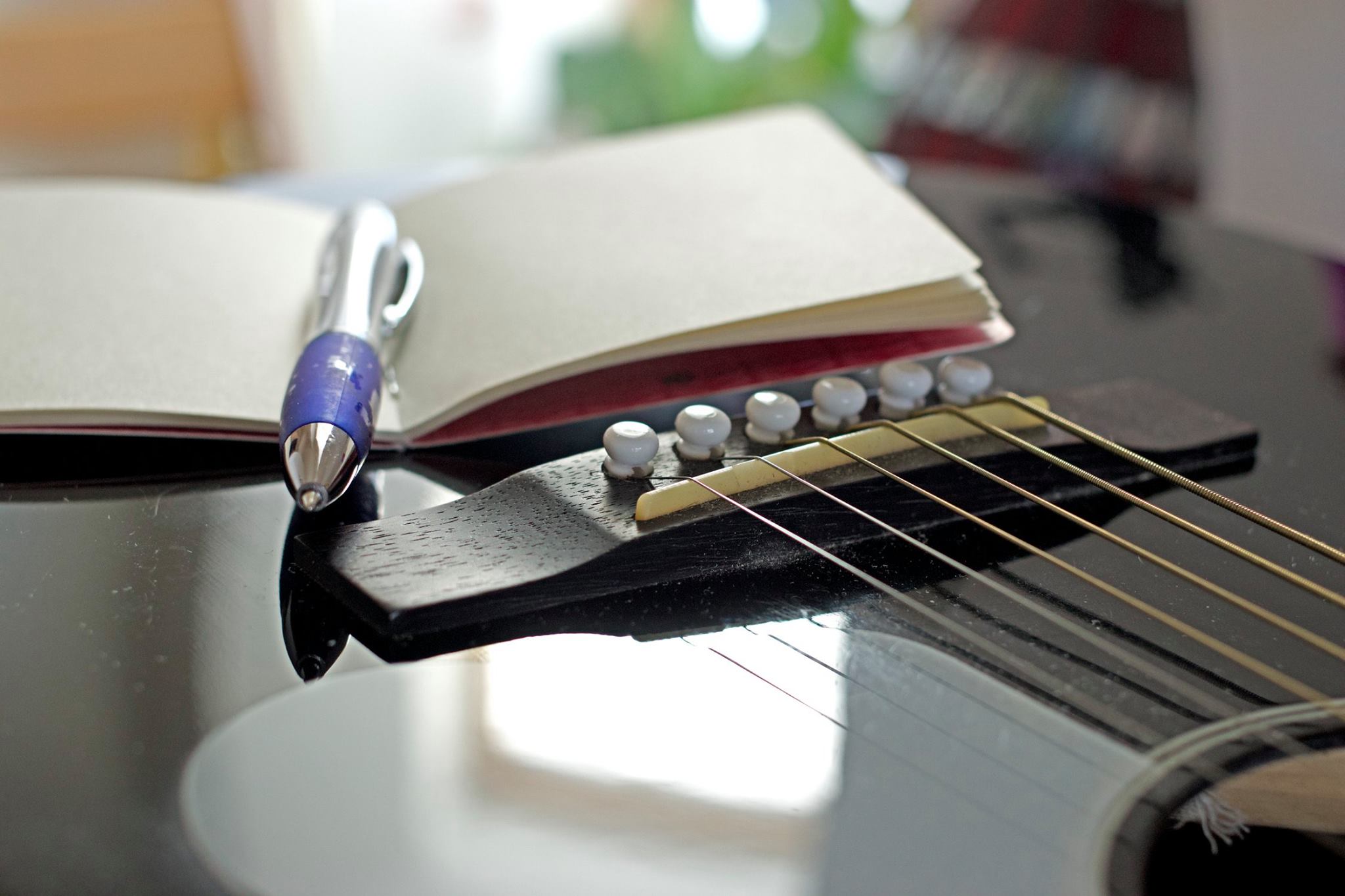 Acoustic Guitar and notepad